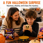 Parent supervising child playing with Halloween mystery squishy