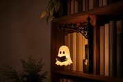 Glowing ghost bookshelf lantern installed between books on a wooden shelf