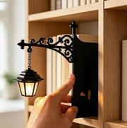 Vintage hanging bookshelf lantern with ornate black bracket and bookend plate